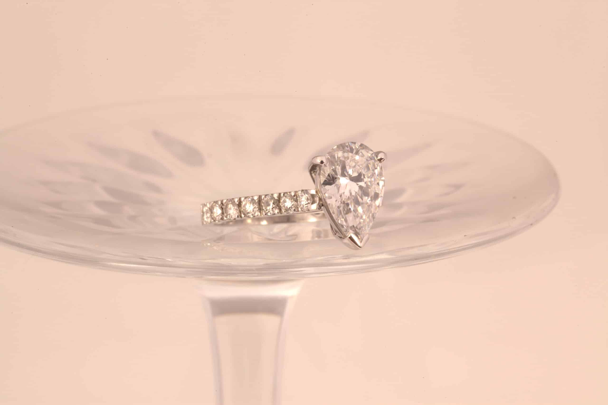 Pear shape diamond on wine glass