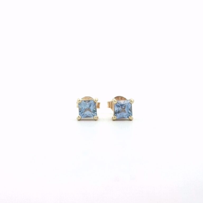 Blue square stud earrings on display