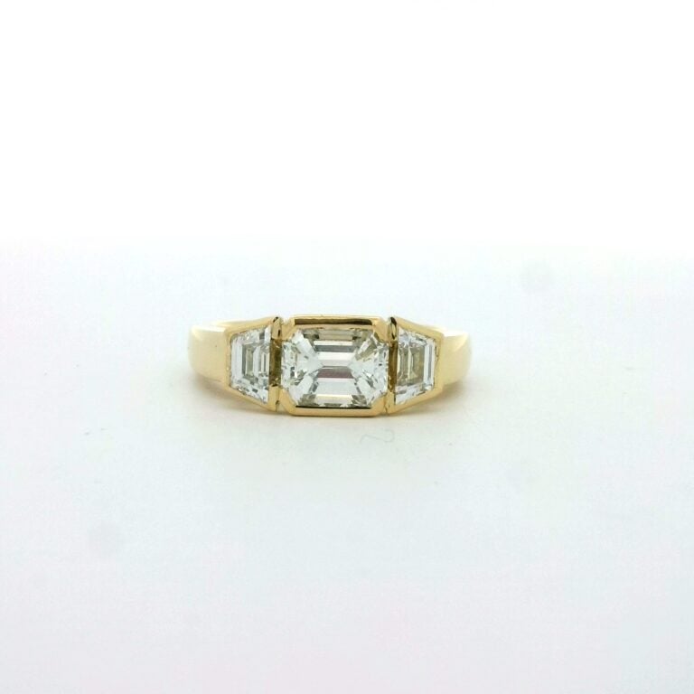 Farah &ndash; 1.5ct Emerald and Trapezoid Diamond Trilogy Engagement Ring
