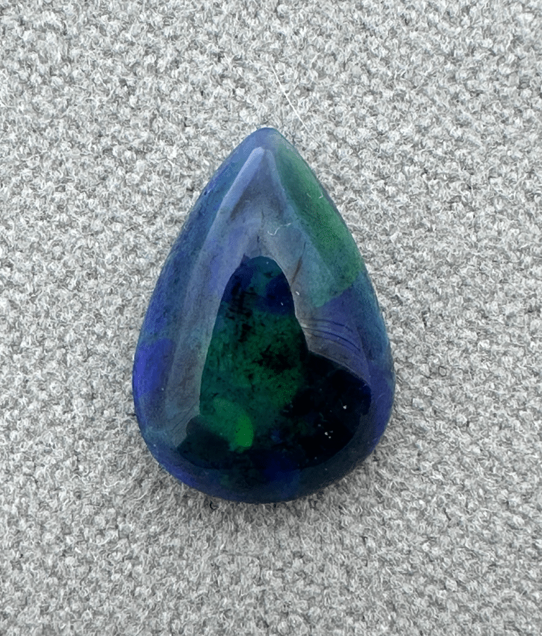 Teardrop-shaped blue and green gemstone