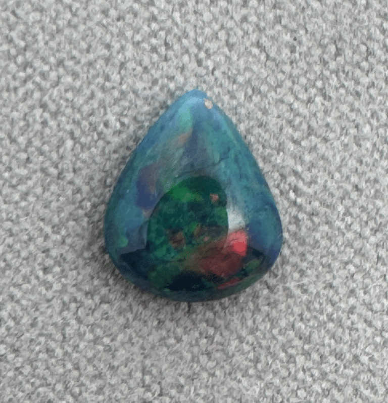 Colorful teardrop-shaped gemstone